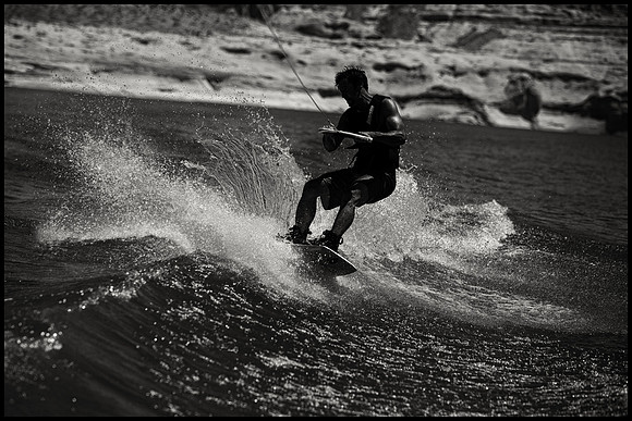 Black and White wakeboard image gouging lip in Lake Powell, AZ